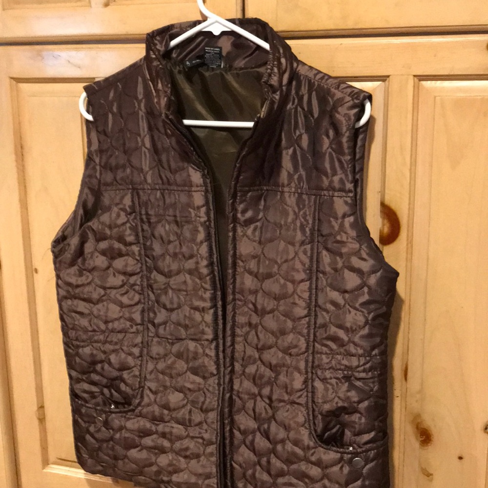 Brown vest, can be gathered in back for shape